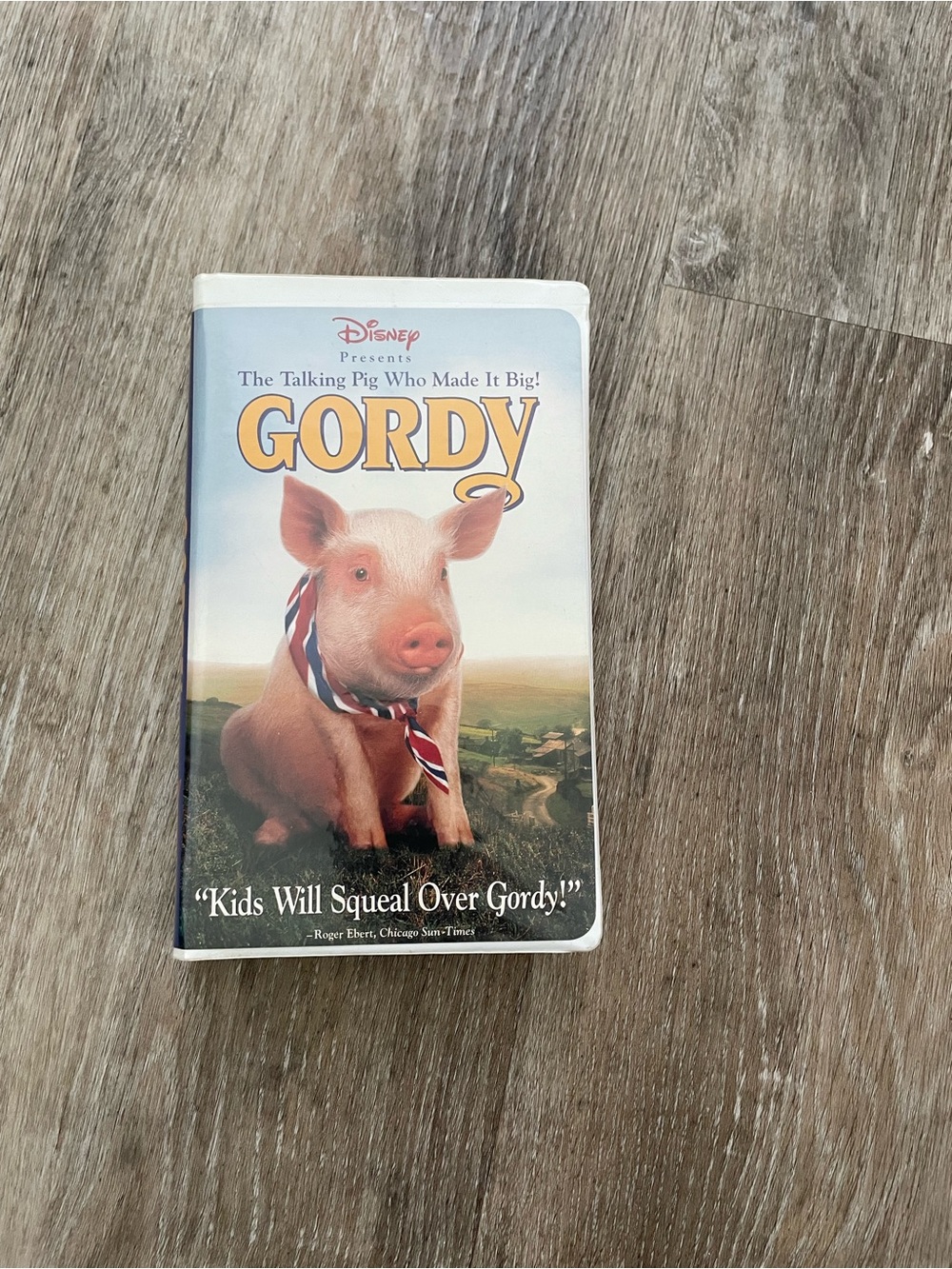 Disney Gordy VHS Cover Featuring Pink Pig with Red, White and Blue Ribbon